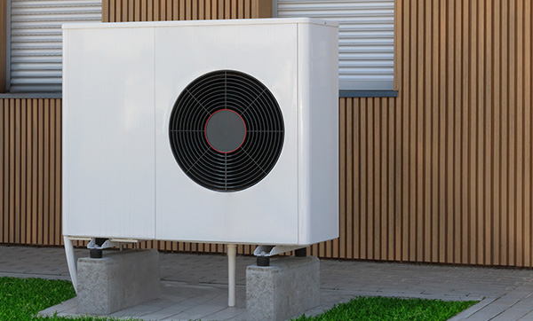 outdoor air conditioning unit installed next to a building featuring a modern design and fan emphasizing energy efficiency and performance for climate control six seasons