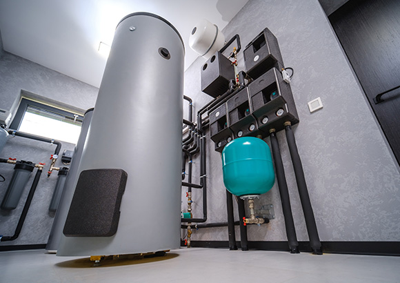 modern boiler room equipment featuring a grey hot water tank and interconnected pipes showcasing efficient water heating solutions for optimal six unit operations